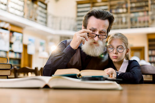 Girl with Grandfather in Library