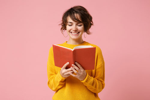 Girl in Yellow Sweater Reading