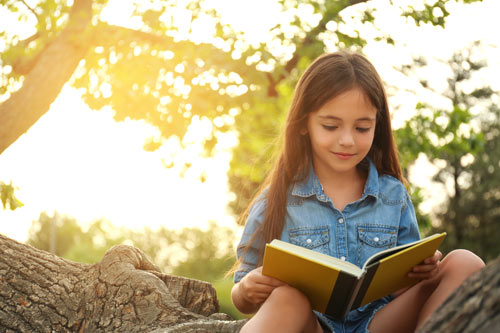 Girl Reading in Tree